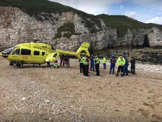 The youngster was airlifted to hospital after falling from a cave wall