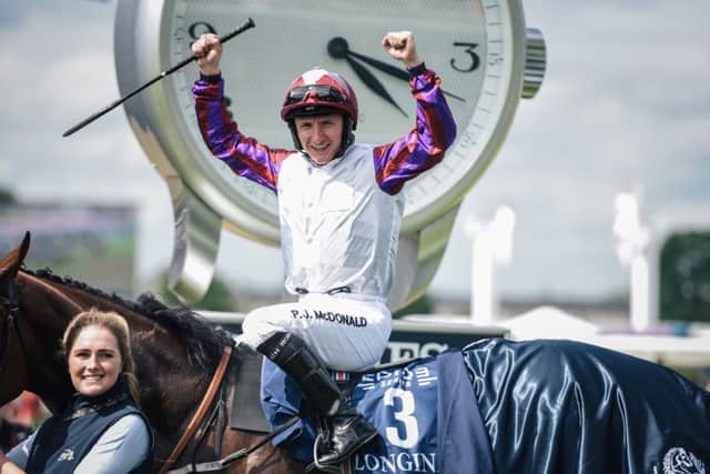 CLASSIC WIN: Jockey PJ Mcdonald & Laurens celebrate winning the 169th edition of the Prix de Diane at Chantilly. Picture: LUCAS BARIOULET/AFP/Getty Images