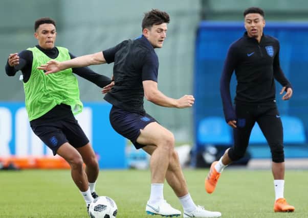 Trent Alexander-Arnold gets the better of England team-mate Harry Maguire (Picture: Alex Morton/Getty Images).