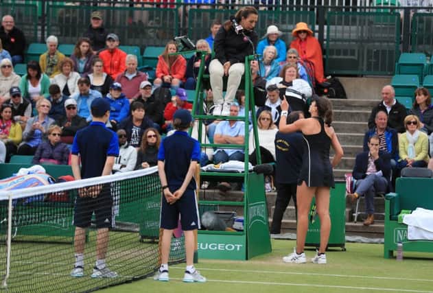 Johanna Konta argues with umpire Paula Vieira Souza during her WTA Singles Final match with Ashleigh Barty at the Nature Valley Open at Nottingham. Picture: Mike Egerton/PA Wire