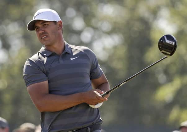 Brooks Koepka plays from the ninth tee on his way to successive wins in the US Open (Picture: Julio Cortez/AP).