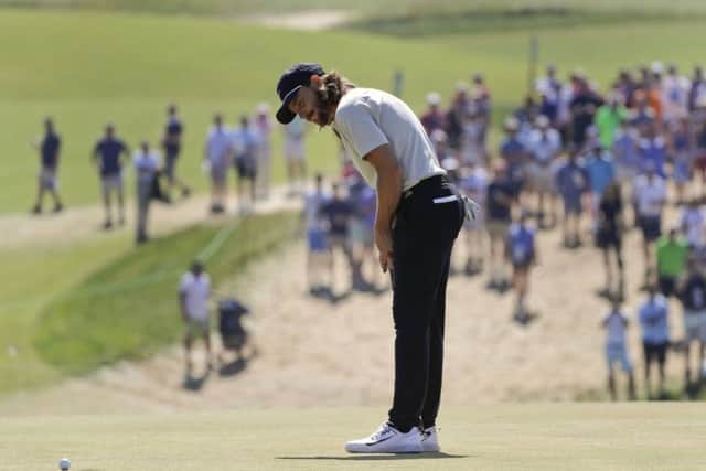 Tommy Fleetwood  misses a putt for birdie on the 18th green at Shinnecock Hills. It would have given him a 62 and a US Open play-off against Brooks Koepka (Picture: Frank Franklin II/AP).