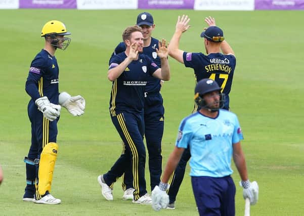 Hampshire's Liam Dawson (centre) celebrates taking the wicket of Yorkshire's Jack Leaning.