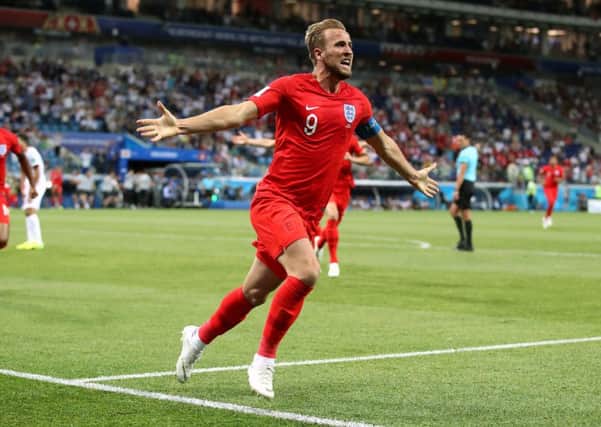 Harry Kane celebrates England's last gasp winner against Tunisia in the World Cup.
