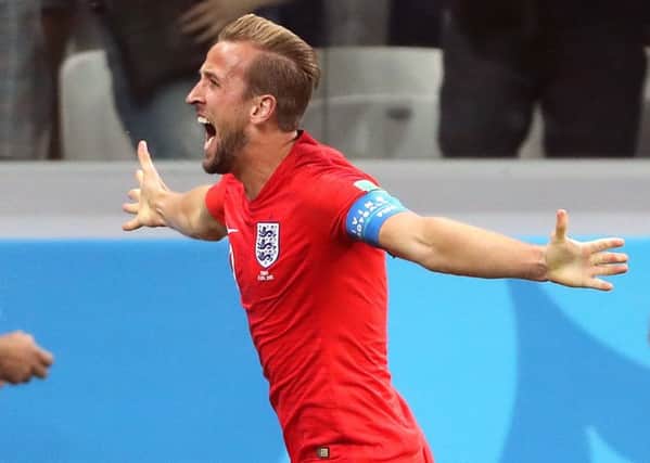 Talisman: England's Harry Kane celebrates scoring his side's winner.