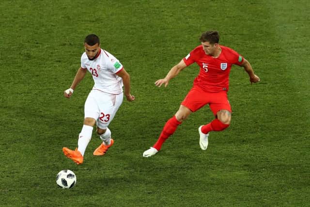 Tunisia's Naim Sliti (left) and England's John Stones battle for the ball in the Group G opener in Volgograd. Picture: Tim Goode/PA