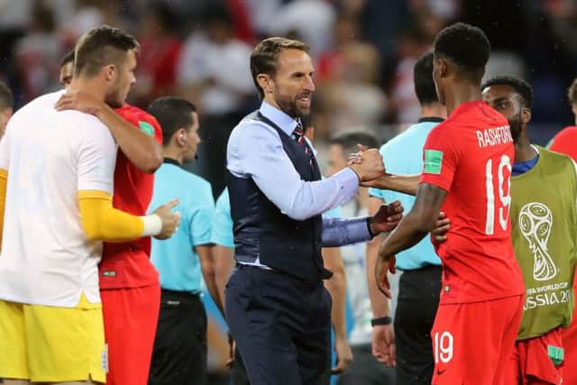 England manager Gareth Southgate (centre) and Marcus Rashford celebrate after the final whistle. Picture: Owen Humphreys/PA