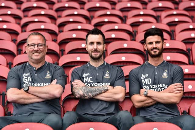 Bradford City's new head coach Michael Collins, centre, with Greg Abbott, left, and Martin Drury, right.