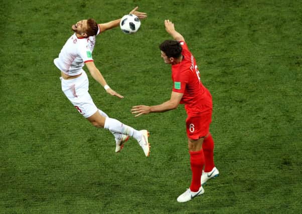 Tunisias Fakhreddine Ben Youssef assumes a dramatic pose in a challenge with Englands Harry Maguire in Monday nights game (Picture: Tim Goode/PA Wire).