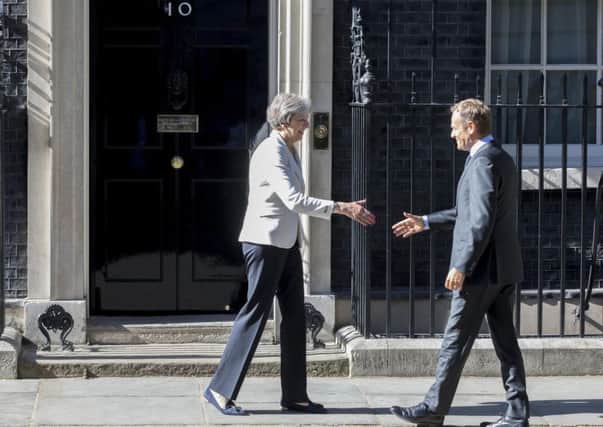 Prime Minister Theresa May greets President of the European Council Donald Tusk outside No 10 Downing Street, London, ahead of this week's EU summit.
