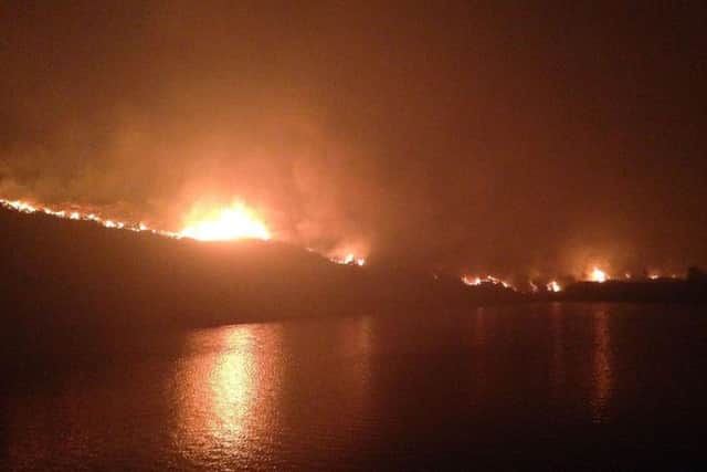 A number of homes have been evacuated as fires on Saddleworth Moor continue to spread. PIC: Sean Quarmby/PA Wire