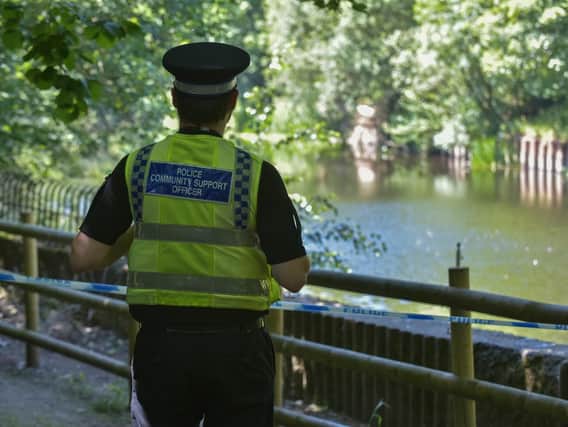 Police at the scene where the body was found, near Kirkstall Road, Leeds. Picture: SWNS.