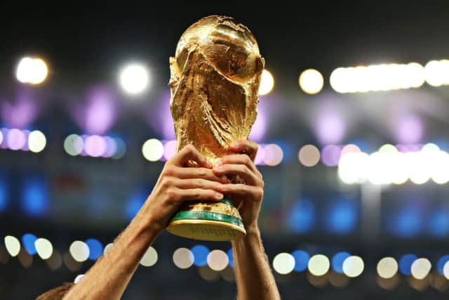 File photo dated 13/07/14 of a player lifting the FIFA World Cup Trophy  PRESS ASSOCIATION