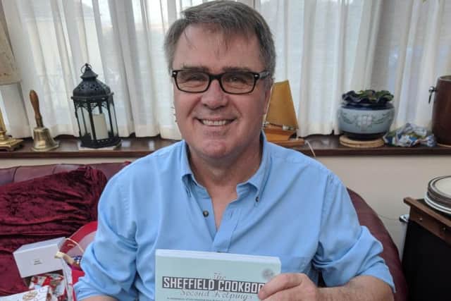 Simon Hook with a copy of The Sheffield Cookbook