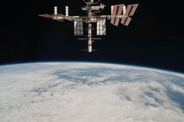 The International Space Station, 220 miles above the Earth