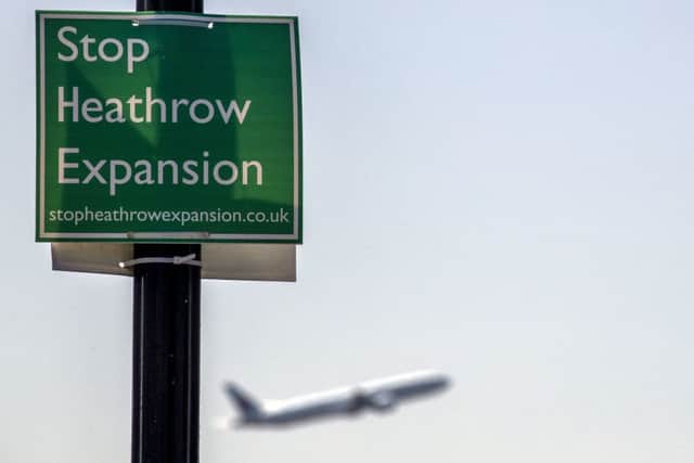 Planes take off at Heathrow Airport where a third runway has been approved this week.
