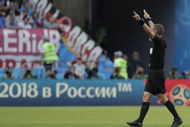 Referee Mark Geiger from the US signals the use of VAR during the group F match between South Korea and Germany, at the 2018 soccer World Cup in the Kazan Arena in Kazan (AP Photo/Lee Jin-man)
