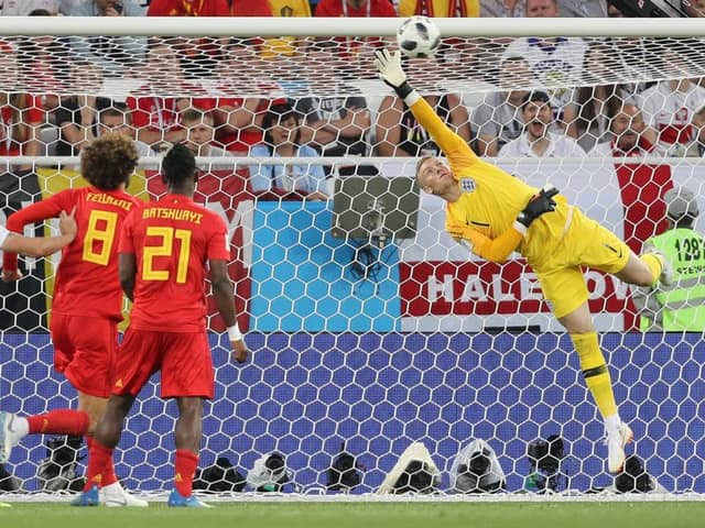 England goalkeeper Jordan Pickford stretches but cannot reach the strike from Adnan Januzaj, out of picture, that gave Belgium victory (Picture: Owen Humphreys/PA Wire).