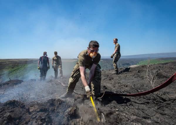Soldiers from the Highlanders, 4th Battalion, Royal Regiment of Scotland continue to support Great Manchester Fire and Rescue Service as they fight the fire on Saddleworth Moor. PIC: PA