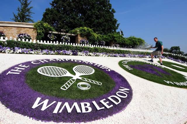 Wimbledon's courts and its flowers will need constant attention in the forecast hot temperatures (Picture: Owen Humphreys/PA Wire).