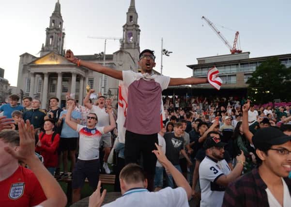 Football Fans watching the Columbia v England World Cup game from the Spartak Stadium in Russia on the large screen in Millennium Square, Leeds, celebrate.
3 July 2018.  Picture Bruce Rollinson