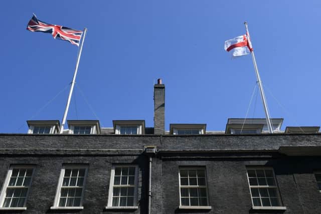 The flag of St George flies over Downing Street during the World Cup.