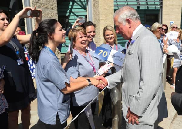 The Prince of Wales meets hospital staff as he visits Ysbyty Aneurin Bevan hospital in Ebbw Vale to mark the 70th anniversary of the NHS.