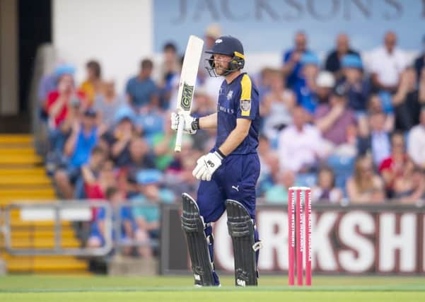Opening out: Yorkshire's Adam Lyth celebrating his half-century on a way to an unbeaten 92 against Durham.
