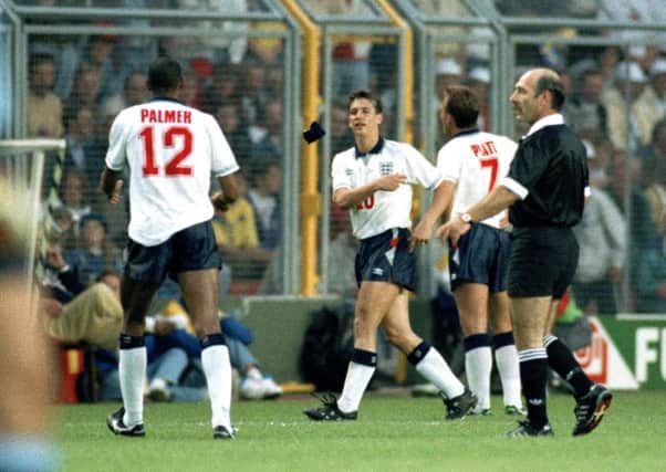 BAD NIGHT: England captain Gary Lineker throws the armband to Carlton Palmer after being substituted in his final match by coach Graham Taylor, with England losing the match against Sweden.  Picture: Getty Images