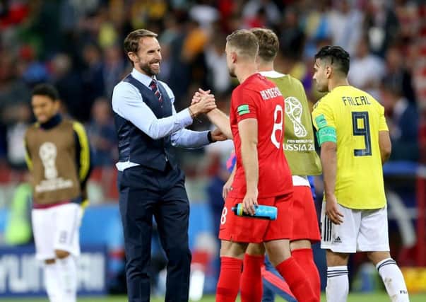 England manager Gareth Southgate (left) celebrates with England's players after beating Colombia. Picture: Tim Goode/PA