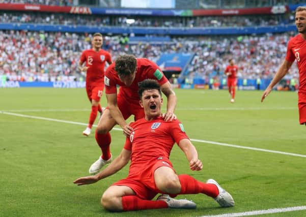 England's Harry Maguire celebrates scoring his side's first goal of the game with John Stones. Picture: Owen Humphreys/PA
