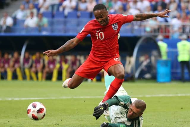 England's Raheem Sterling (left) attempts to go round Sweden goalkeeper Robin Olsen in the first half. Picture: Owen Humphreys/PA