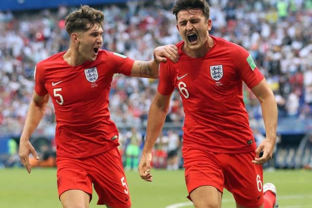 MADE IN YORKSHIRE: England's Harry Maguire (right) celebrates scoring his side's first goal of the game with John Stones . Picture: Owen Humphreys/PA