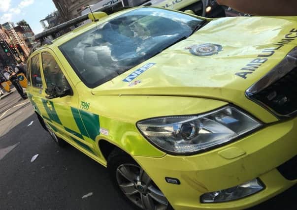 Photo issued by the London Ambulance Service of an emergency response vehicle that was damaged during post match celebrations.