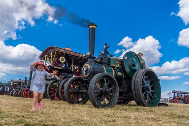 The Great Yorkshire Traction Engine Club, Duncombe Park Steam Rally 2018. Rebecca Wilkinson, 5, of Thirsk, runs past the display of Traction Engines.