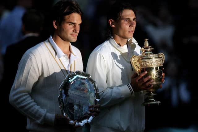 Spain's Rafael Nadal and Switzerland's Roger Federer with their trophies in the Mens Final during the Wimbledon Championships 2008 (Picture: PA)