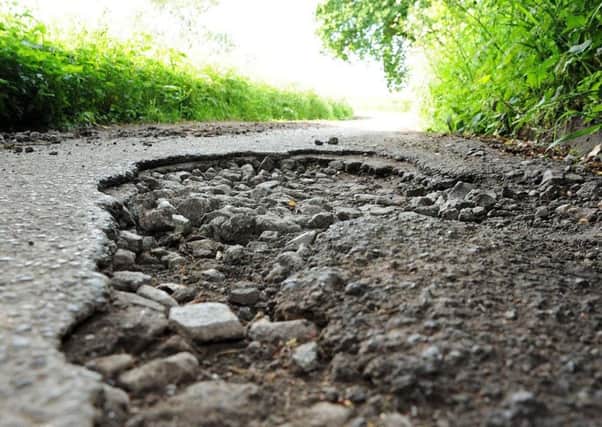 Potholes continue to cause a hazard on the region's roads.