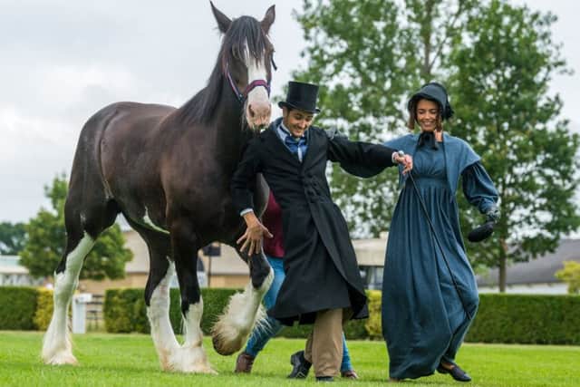 Models Ronan Carter and Isabelle Mason wearing period costumes that would have been worn at the very first Great Yorkshire Show in 1838. The pair are pictured with a Clydesdale, Camalter Poppy, from Sledmere House Stables.