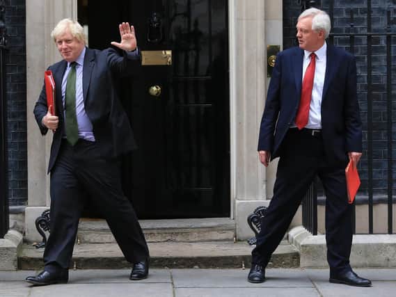 Foreign Secretary Boris Johnson (left) and Brexit Secretary David Davis (right) have quit the Cabinet in protest at Theresa May's plans for a "common rulebook" with the EU on goods.