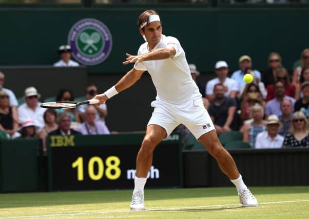 Roger Federer returns on his way to a 6-0 7-5 6-4 victory over Adrian Mannarino (Picture: Jonathan Brady/PA Wire).