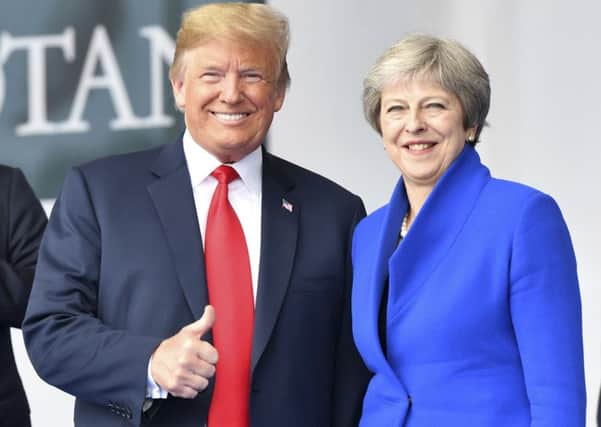 President Donald Trump meets Theresa May at the Nato summit.