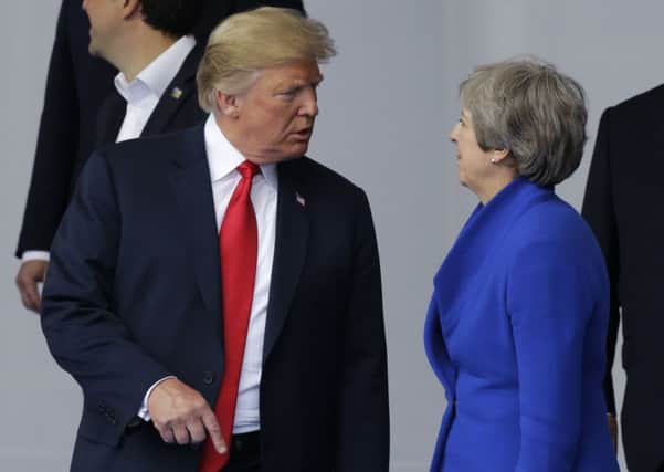 President Donald Trump and Theresa May at the Nato summit.