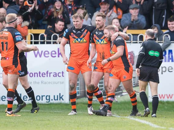 Castleford Tigers' James Clare celebrates scoring a try against Salford Red Devils earlier this year. (Allan McKenzie/SWpix.com)