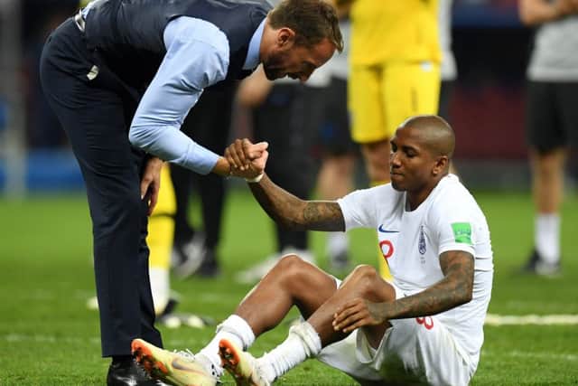 MOSCOW, RUSSIA - JULY 11:  Gareth Southgate, manager of England consoles Ashley Young following their defeat to Croatia. (Picture: Matthias Hangst/Getty Images)
