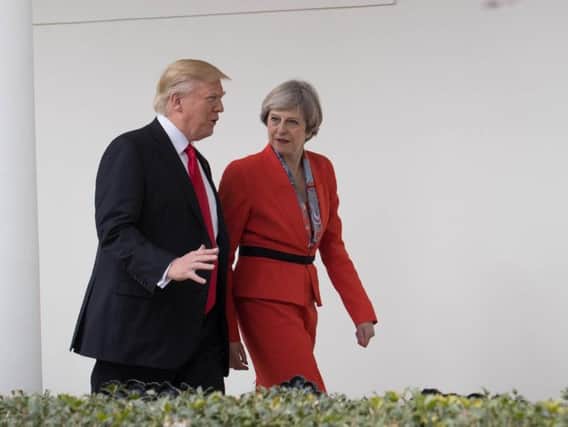 Prime Minister Theresa May and US President Donald Trump outside the White House in Washington, USA. PIC: Stefan Rousseau/PA Wire