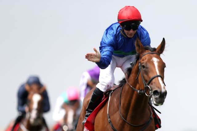 Wells farhh Go galloped into St Leger contention when winning the Bahrain Trophy under David Allan at Newmarket.