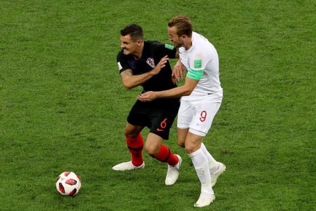 Dejan Lovren battles with Harry Kane during the World Cup semi-final (Picture: PA)