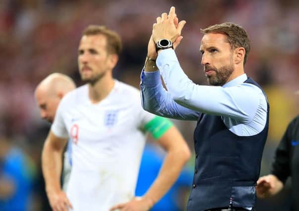 England manager Gareth Southgate, alongside captain Harry Kane, applauds the fans after the World Cup semi-final defeat to Croatia (Picture: Adam Davy/PA Wire).
