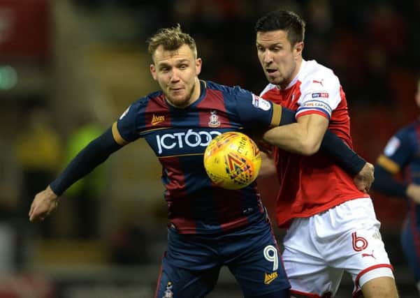 Bradford City's Charlie Wyke, left, seen in combat with Rotherham United's Richard Wood (Picture: Bruce Rollinson).