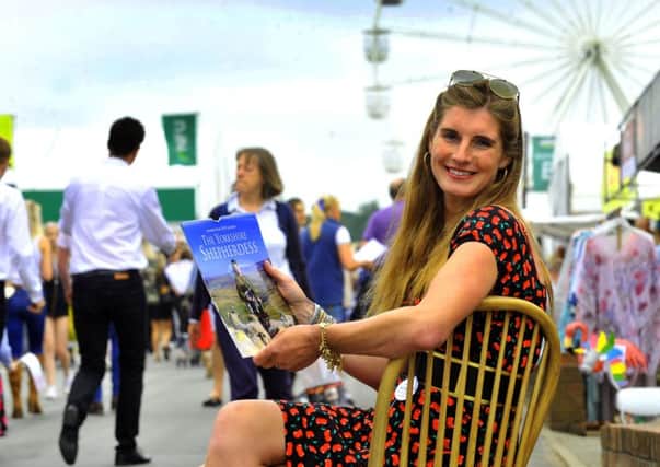 120718   The Yorkshire Shepherdess Amanda Owen with her new 2019 calendar  at the Great Yorkshire Show .